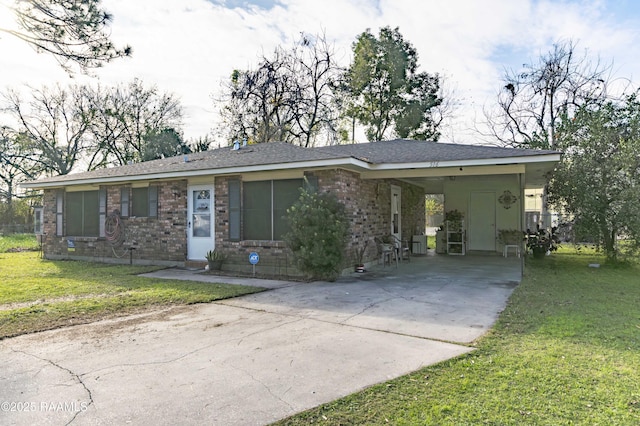 single story home with a front yard and a carport