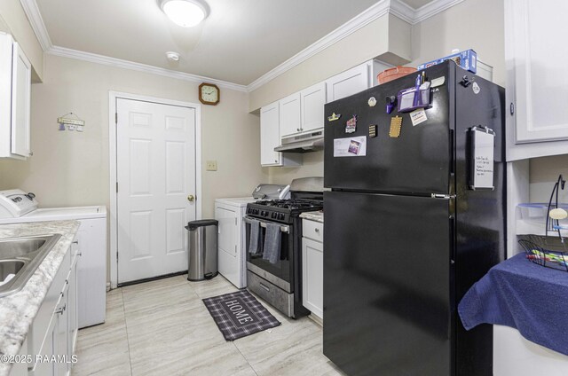 kitchen with white cabinetry, stainless steel range with gas cooktop, black refrigerator, and independent washer and dryer