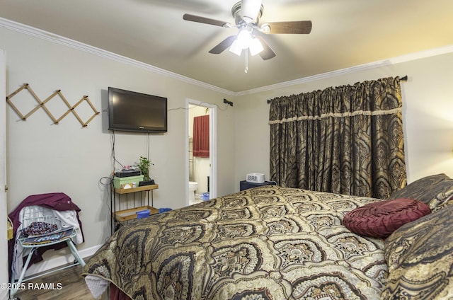 bedroom featuring hardwood / wood-style floors, ensuite bathroom, ceiling fan, and crown molding