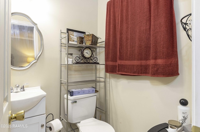 bathroom featuring vanity and toilet