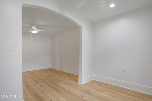 spare room featuring ceiling fan and light hardwood / wood-style flooring