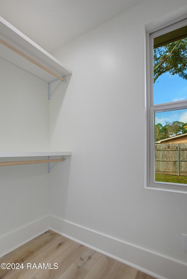 spacious closet with light wood-type flooring