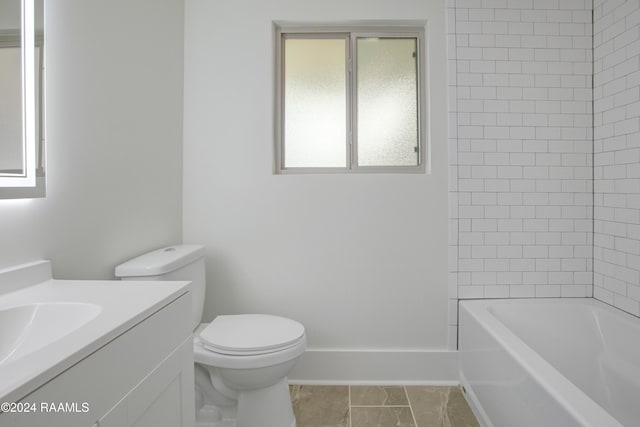 full bathroom featuring vanity, toilet, and tiled shower / bath combo