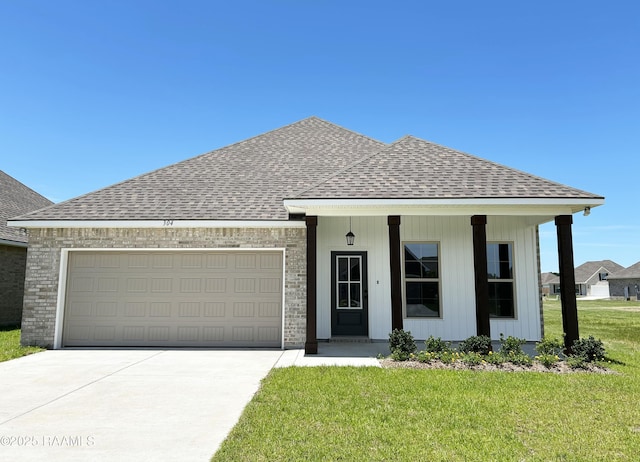 304 Weaver Way, Maurice, LA 70555 - view of front of property with a shingled roof, driveway, a front lawn, and an attached garage