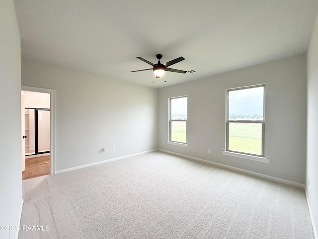 304 Weaver Way, Maurice, LA 70555 - spare room featuring light colored carpet, a ceiling fan, and baseboards