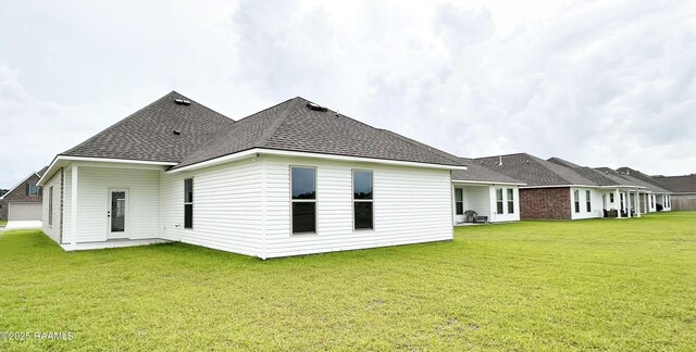 304 Weaver Way, Maurice, LA 70555 - rear view of house featuring a yard and roof with shingles