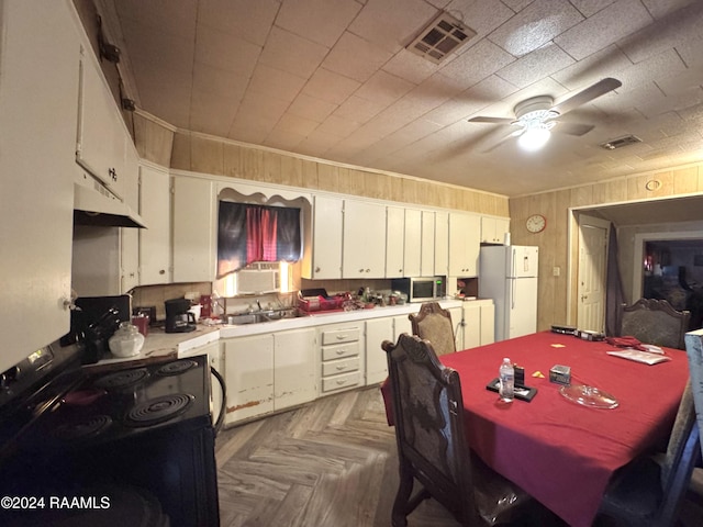 kitchen with ceiling fan, white cabinetry, dark parquet floors, black electric range oven, and white refrigerator