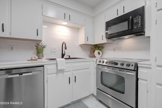 kitchen featuring sink, white cabinets, and appliances with stainless steel finishes