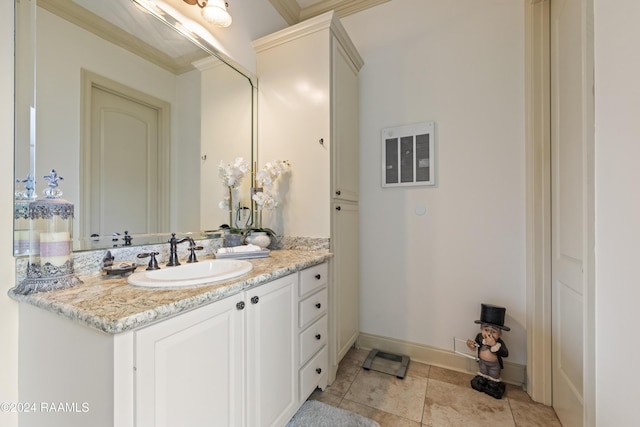 bathroom with vanity and crown molding