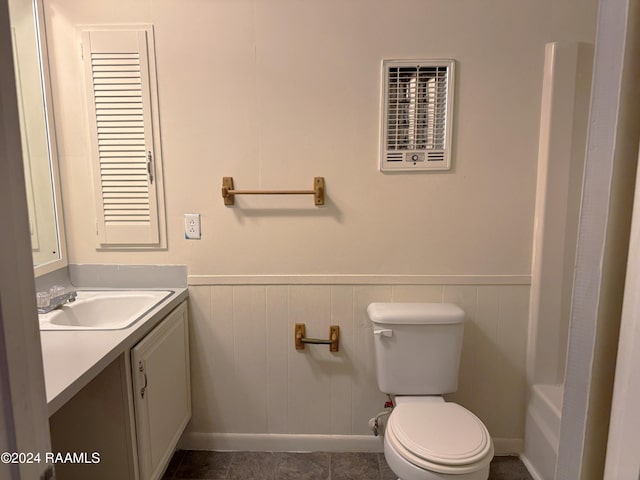 bathroom with tile patterned flooring, vanity, and toilet