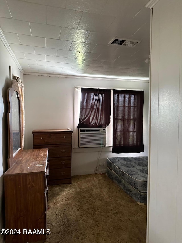 unfurnished bedroom with cooling unit, dark carpet, and ornamental molding