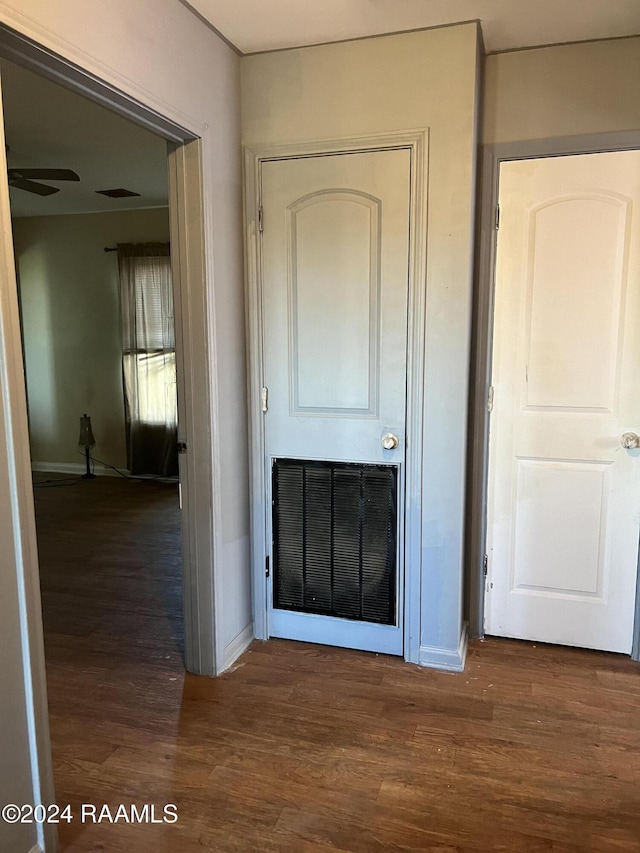 hall with dark hardwood / wood-style flooring