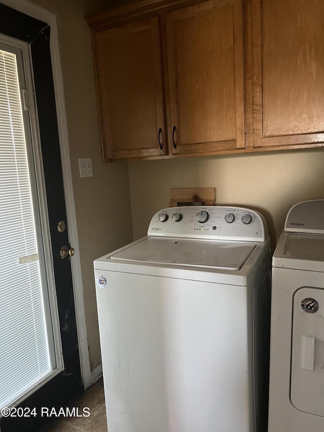 washroom with cabinets and separate washer and dryer