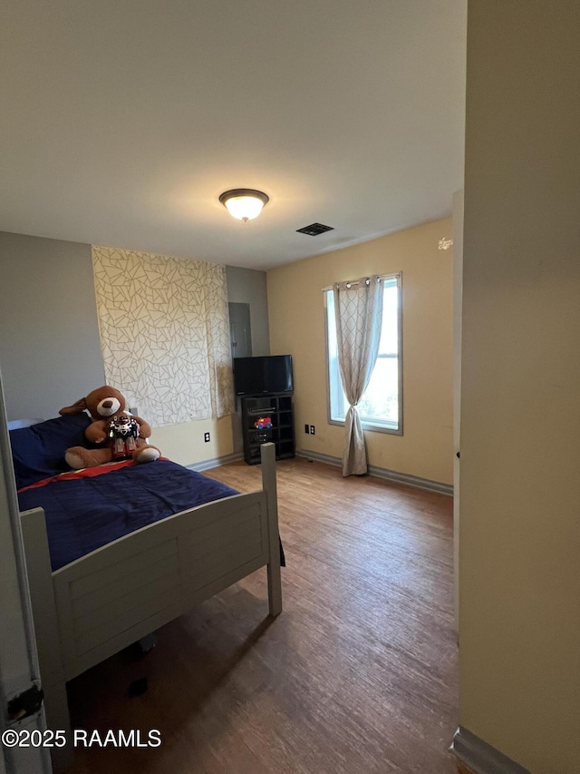 bedroom featuring hardwood / wood-style floors