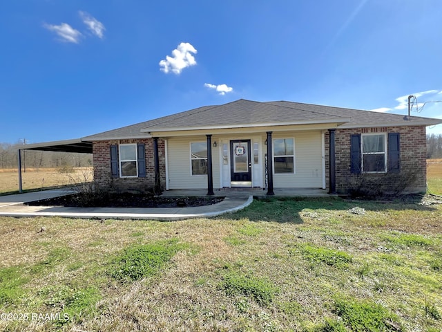 ranch-style house with a front yard and a carport