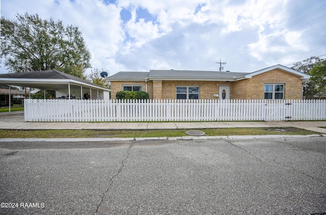 view of front of property featuring a carport