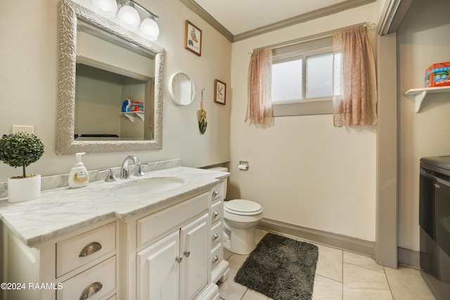 bathroom featuring tile patterned flooring, vanity, toilet, and crown molding