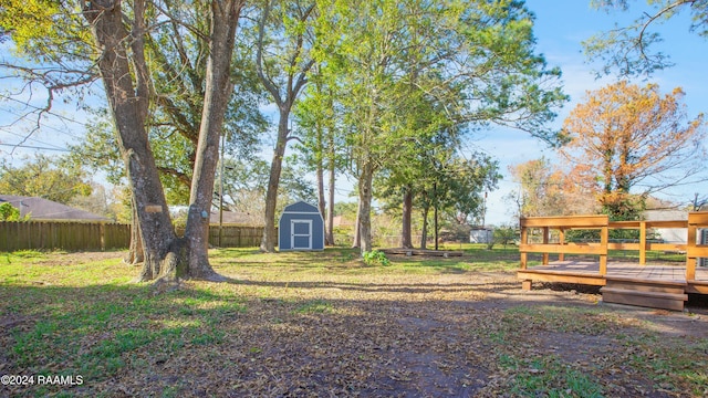 view of yard with a shed and a deck