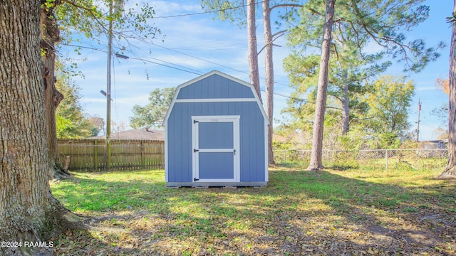 view of outdoor structure featuring a lawn