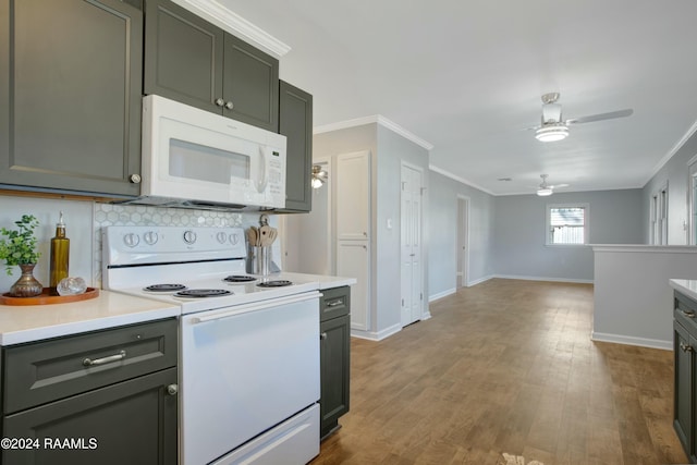 kitchen featuring backsplash, white appliances, ceiling fan, crown molding, and light hardwood / wood-style flooring