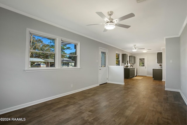 unfurnished living room featuring ceiling fan, dark hardwood / wood-style flooring, and ornamental molding