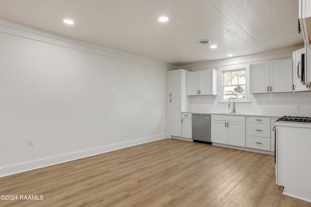 kitchen with light wood-type flooring, stainless steel dishwasher, sink, and white cabinets