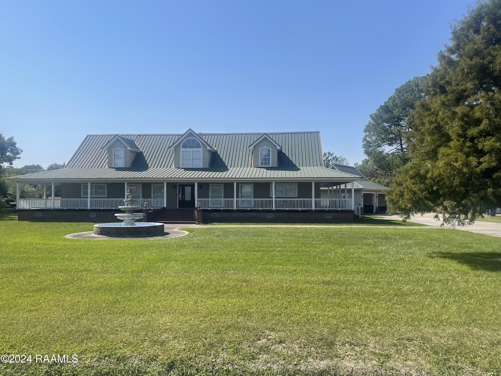 farmhouse with a front lawn and a porch