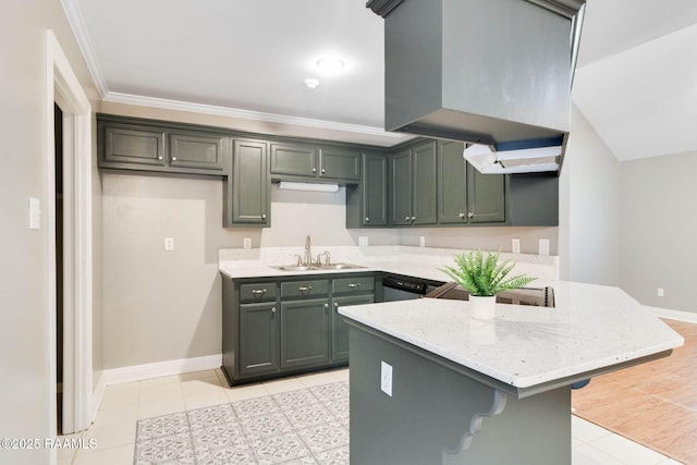 kitchen with a breakfast bar area, ornamental molding, light stone countertops, a sink, and a peninsula