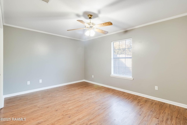 spare room with crown molding, light hardwood / wood-style flooring, and ceiling fan