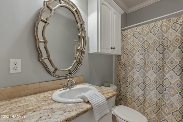 bathroom featuring ornamental molding, toilet, and vanity