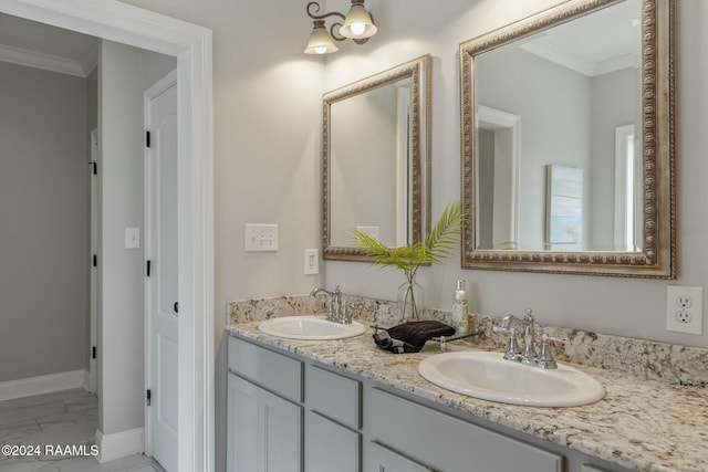 bathroom with vanity and ornamental molding