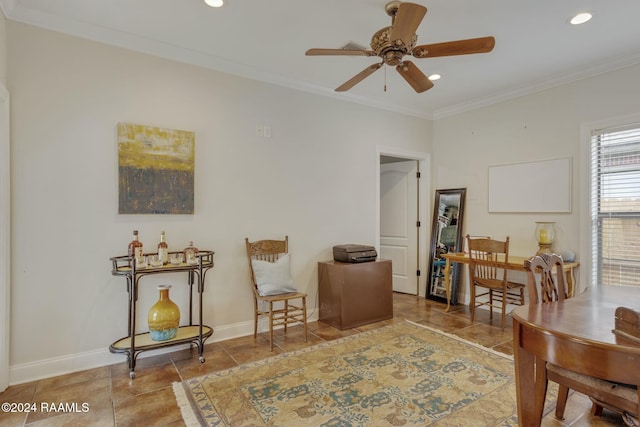 sitting room with ornamental molding and ceiling fan