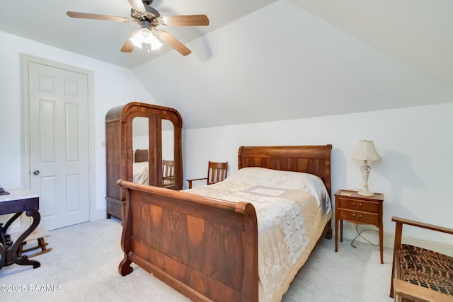 bedroom with light carpet, ceiling fan, and lofted ceiling