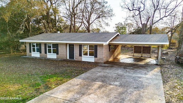 single story home featuring a carport