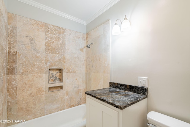 bathroom featuring tiled shower / bath combo, crown molding, and toilet