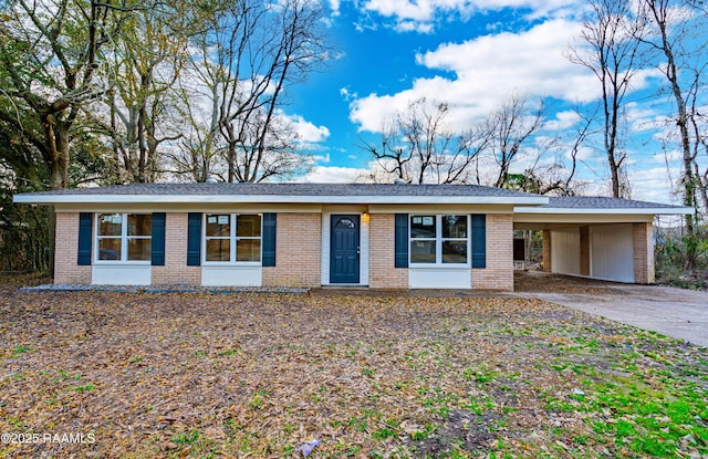 ranch-style house featuring a carport