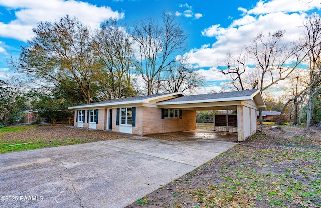 ranch-style home with a carport