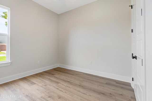 spare room with light wood-type flooring