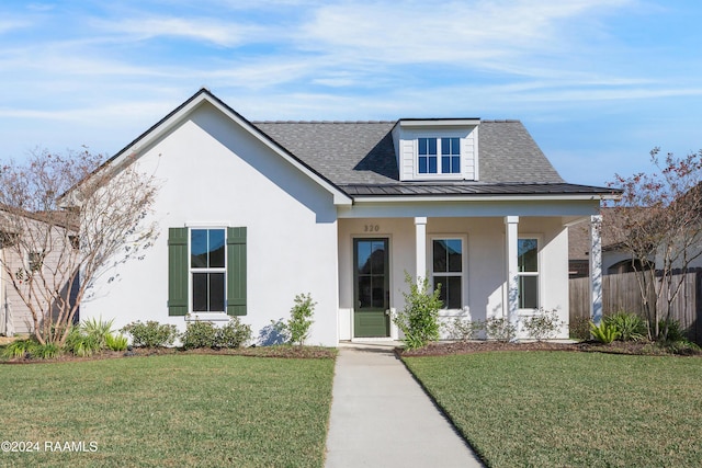 view of front of home featuring a front yard and a porch