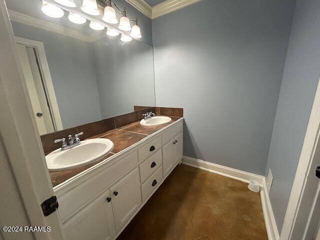 bathroom with vanity and crown molding