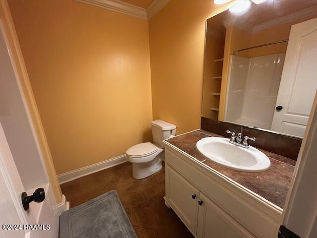 bathroom featuring vanity, crown molding, a shower, and toilet