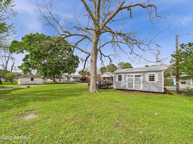 view of yard with an outdoor structure and a storage shed