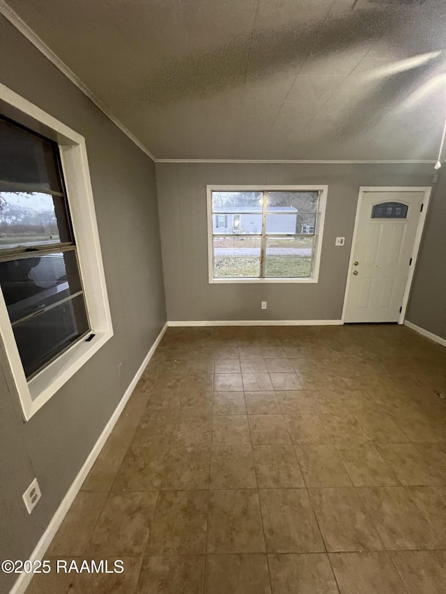 tiled foyer entrance with a textured ceiling