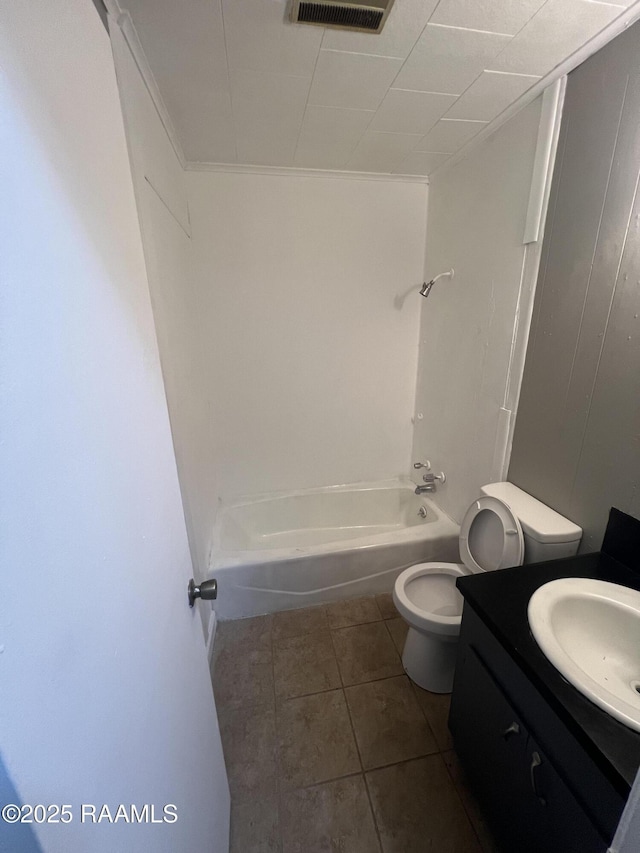 full bathroom with toilet, vanity, tile patterned floors, ornamental molding, and shower / bathing tub combination