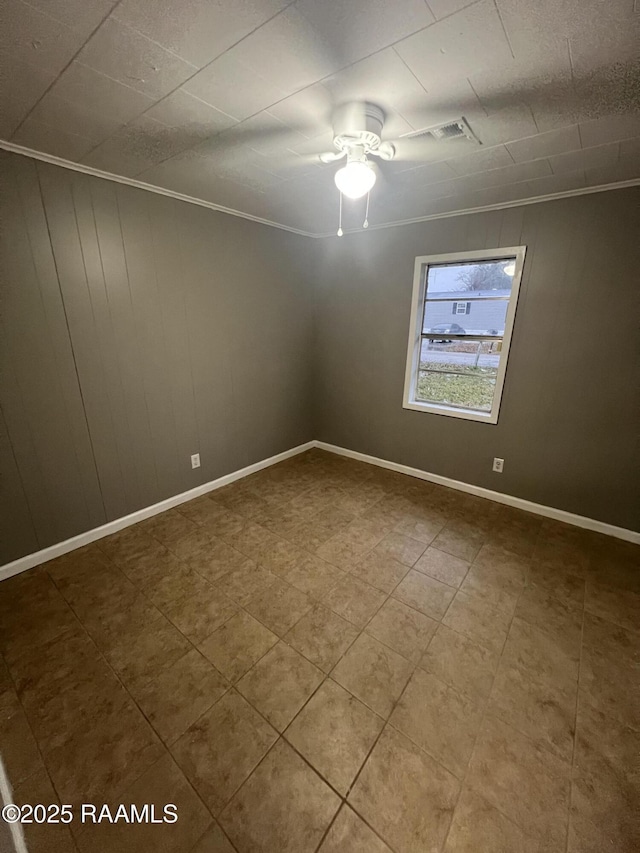 unfurnished room featuring ornamental molding and ceiling fan