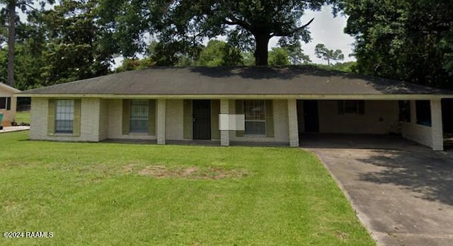 ranch-style house with a front lawn and a carport