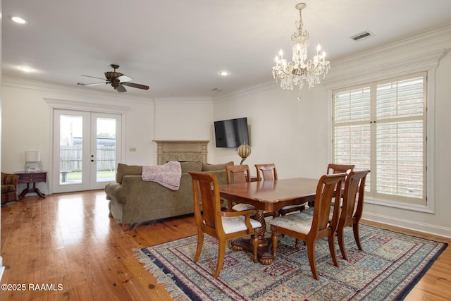 dining area featuring visible vents, plenty of natural light, and crown molding