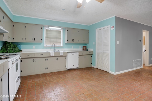 kitchen with ceiling fan, sink, white appliances, and a textured ceiling