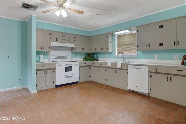 kitchen featuring a textured ceiling, ceiling fan, sink, and white appliances