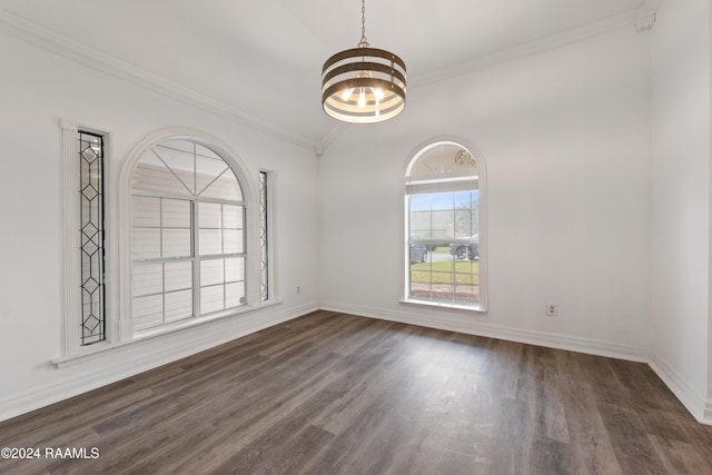 unfurnished room with a chandelier, ornamental molding, vaulted ceiling, and dark wood-type flooring